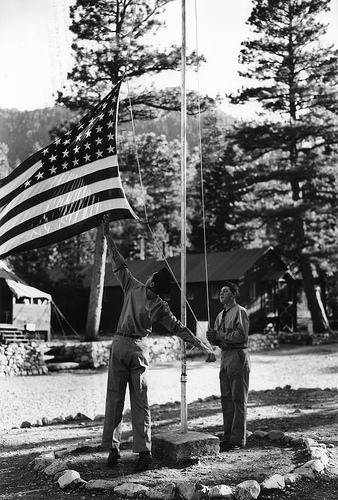 The arm corps raising the flag.