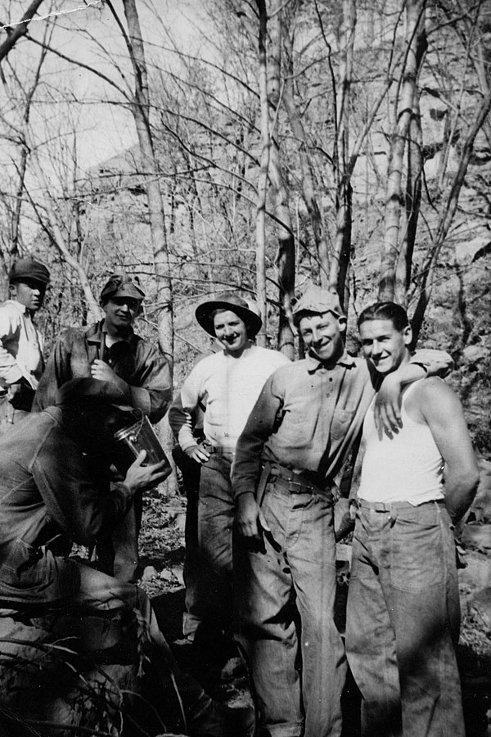 Vintage men giving pose for picture in bonding woods.