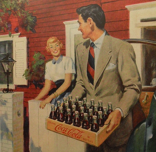 An advertisement for coca cola featuring a gentleman and a woman.