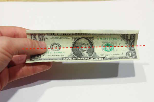 Folded dollar bill in half.