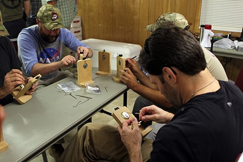 Men picking locks practicing. 