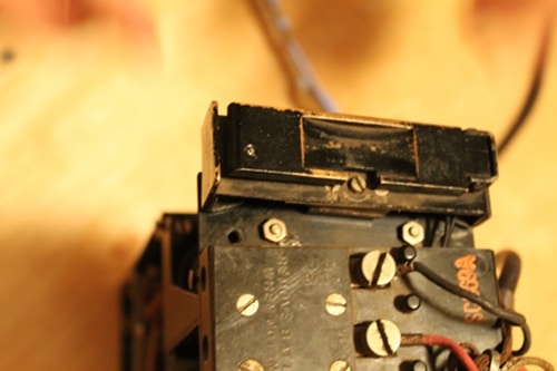 Vintage receiver detached from the top of the field phone.