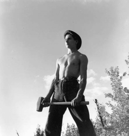 Man holding hammer in his hands.